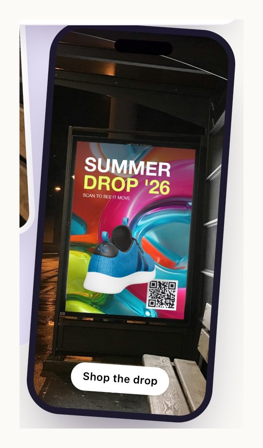 A phone showing a bus stop poster through its camera, with a 3D sneaker standing on the poster and a Shop the drop button