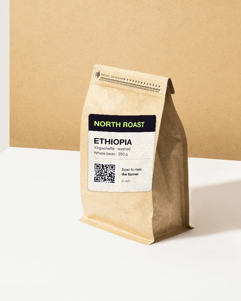 A kraft coffee bag with a North Roast label and a QR code
